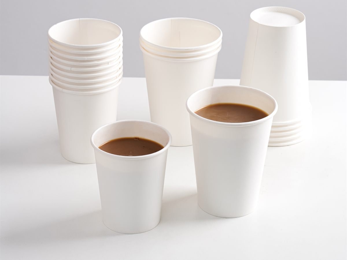 SEALPAK paper cups with coffee beside stacked cups